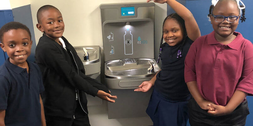 Bradford students presenting new water fountains at the school