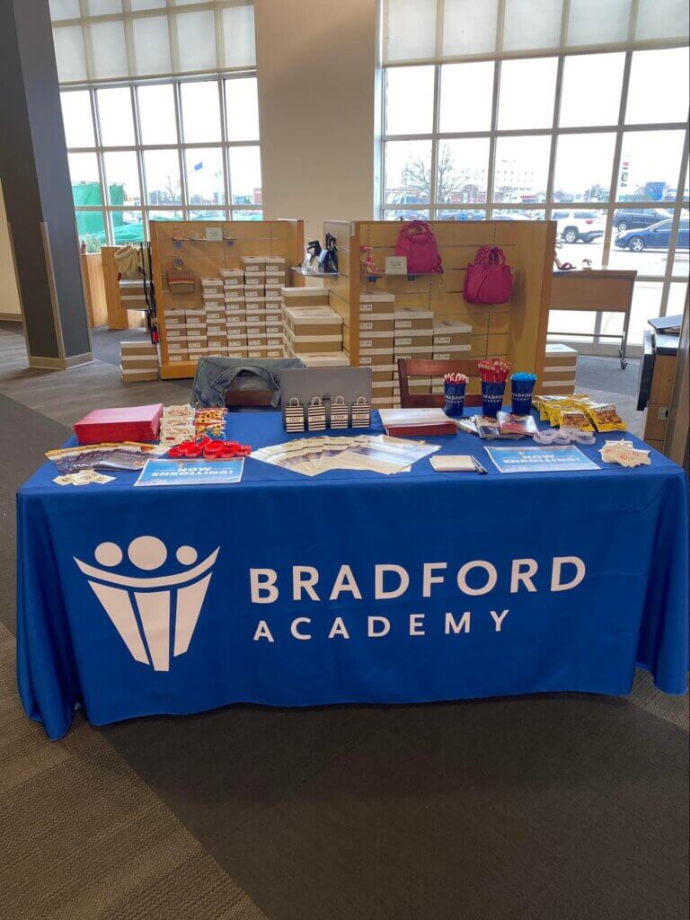 Bradford Academy's stand at the local Designer Shoe Warehouse for parents to enlist in a raffle.